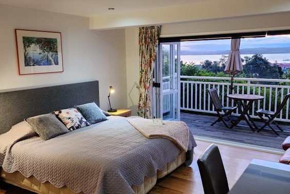 Room #1 bed and balcony
